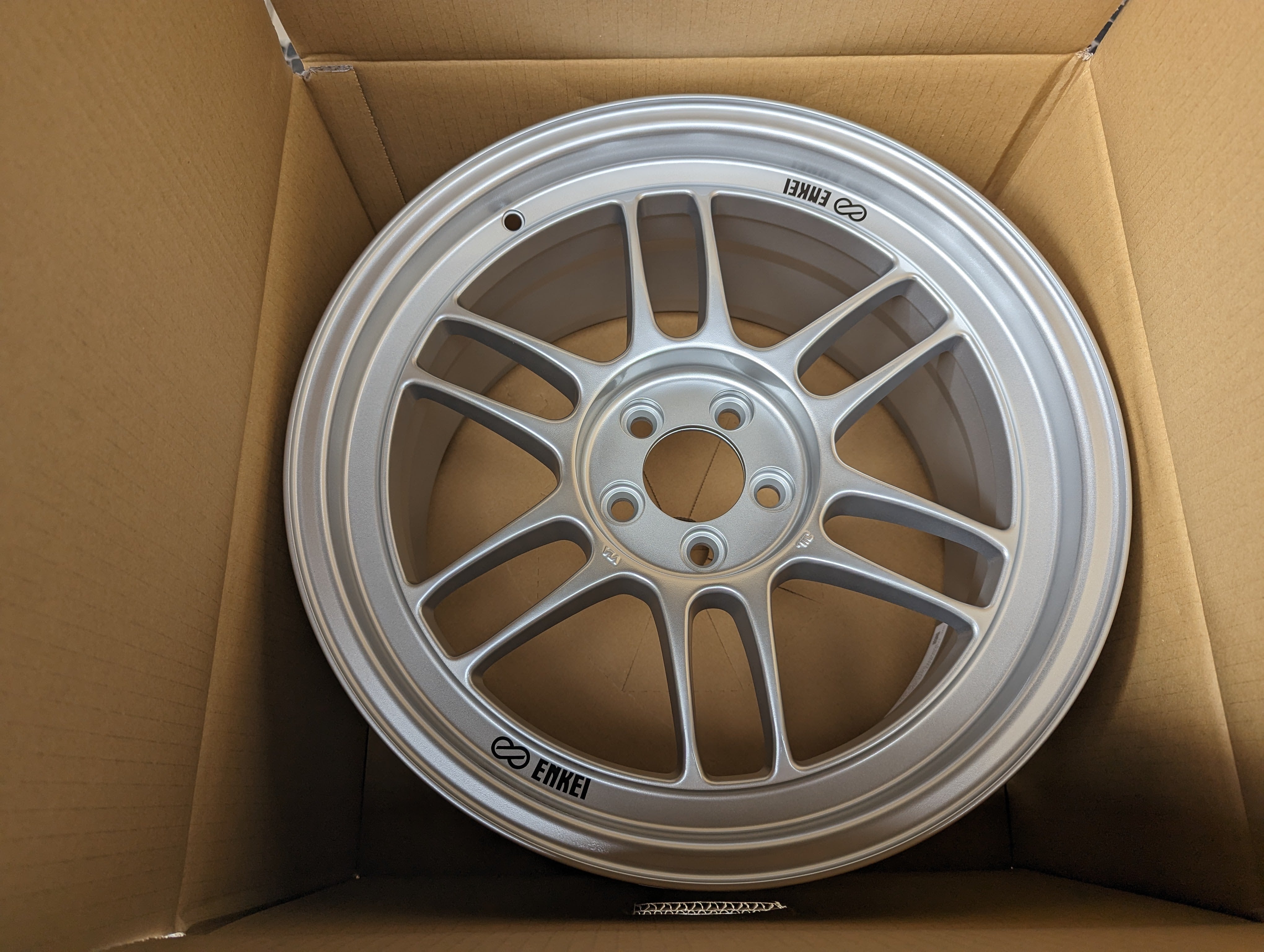 Enkei RPF1 (Silver) with Genuine Enkei Stickers - 5x100 - 17x9 +35