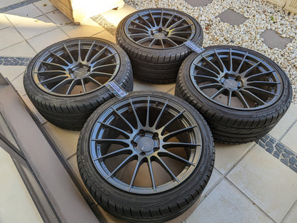 Enkei RS05RR (Dark Gunmetal Gray) with Genuine Enkei Center Caps and Tyres