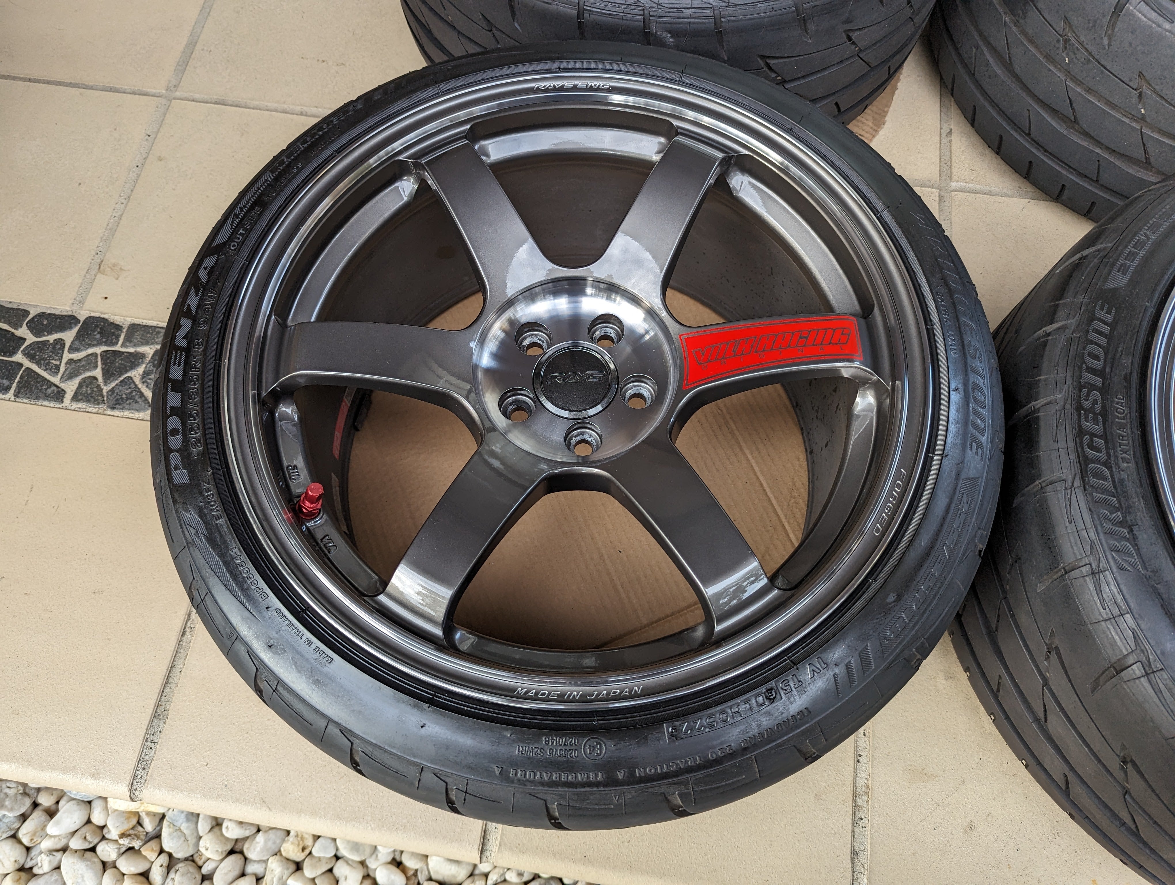 Rays Volk Racing TE37 Saga SL (Pressed Graphite) with Genuine Rays Center Caps and Brand New Bridgestone RE003 Tyres