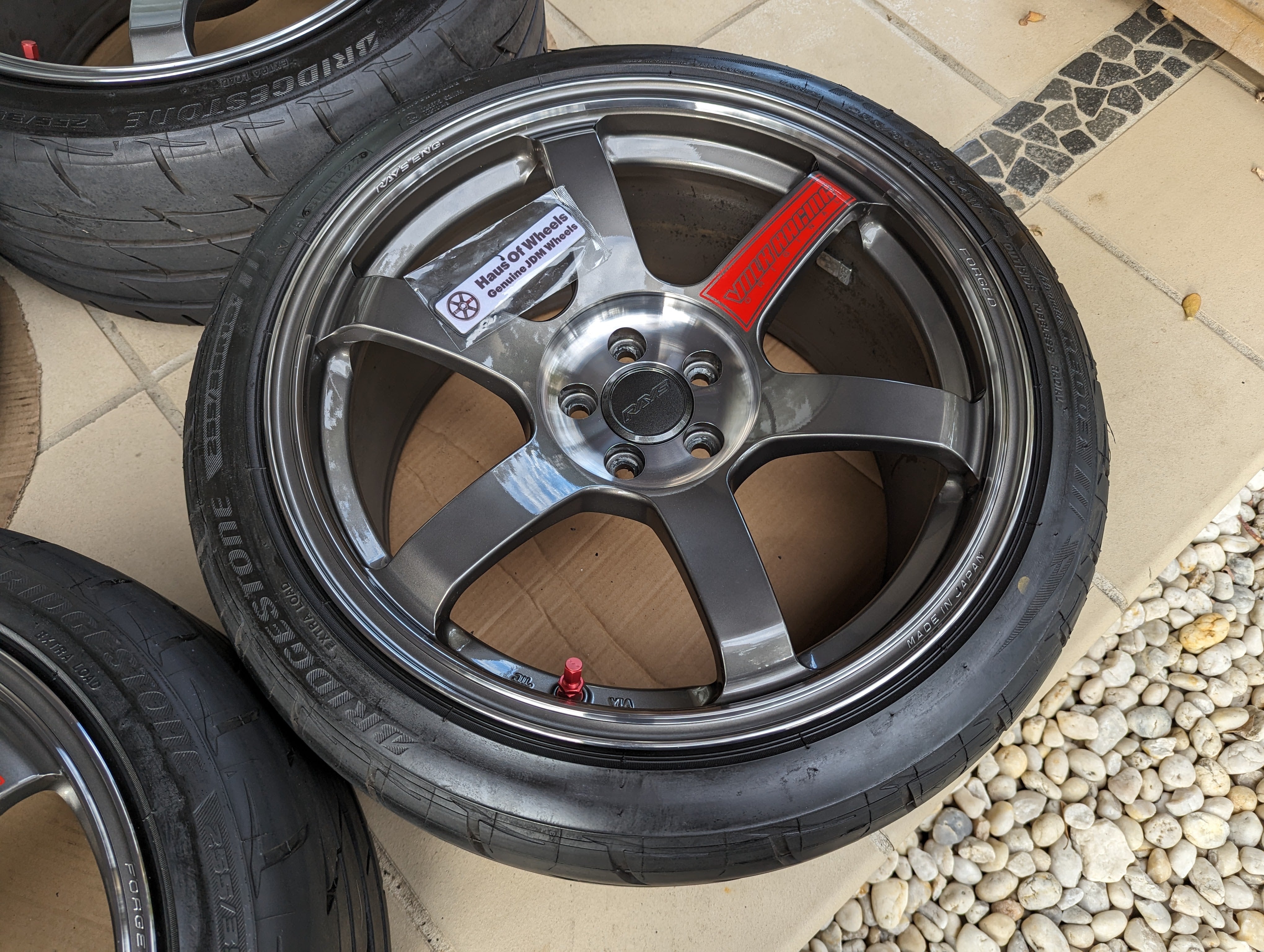 Rays Volk Racing TE37 Saga SL (Pressed Graphite) with Genuine Rays Center Caps and Brand New Bridgestone RE003 Tyres