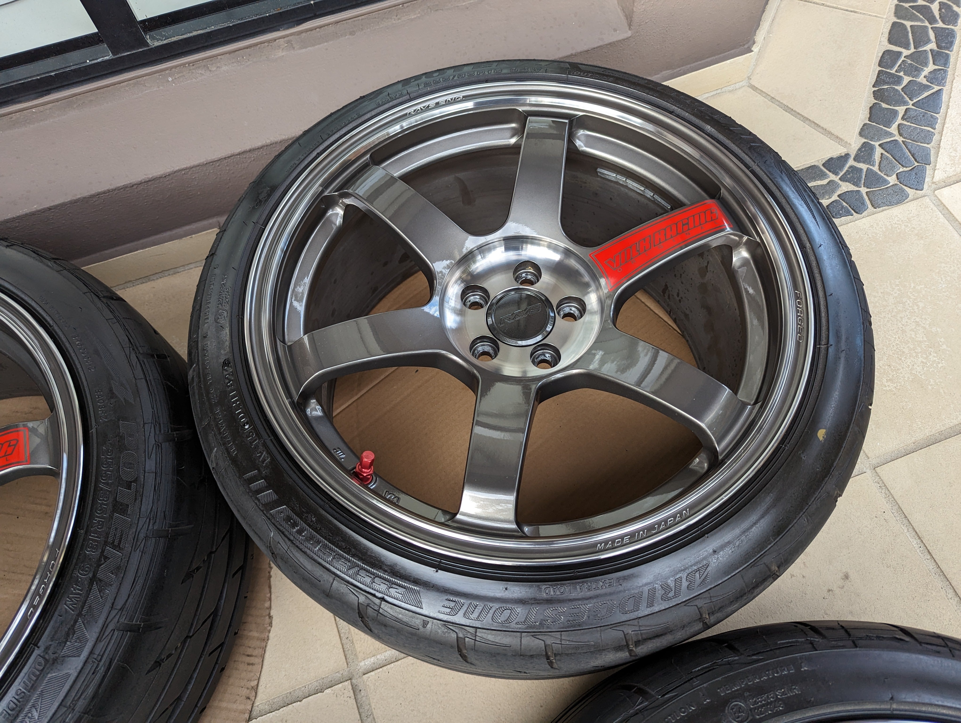 Rays Volk Racing TE37 Saga SL (Pressed Graphite) with Genuine Rays Center Caps and Brand New Bridgestone RE003 Tyres