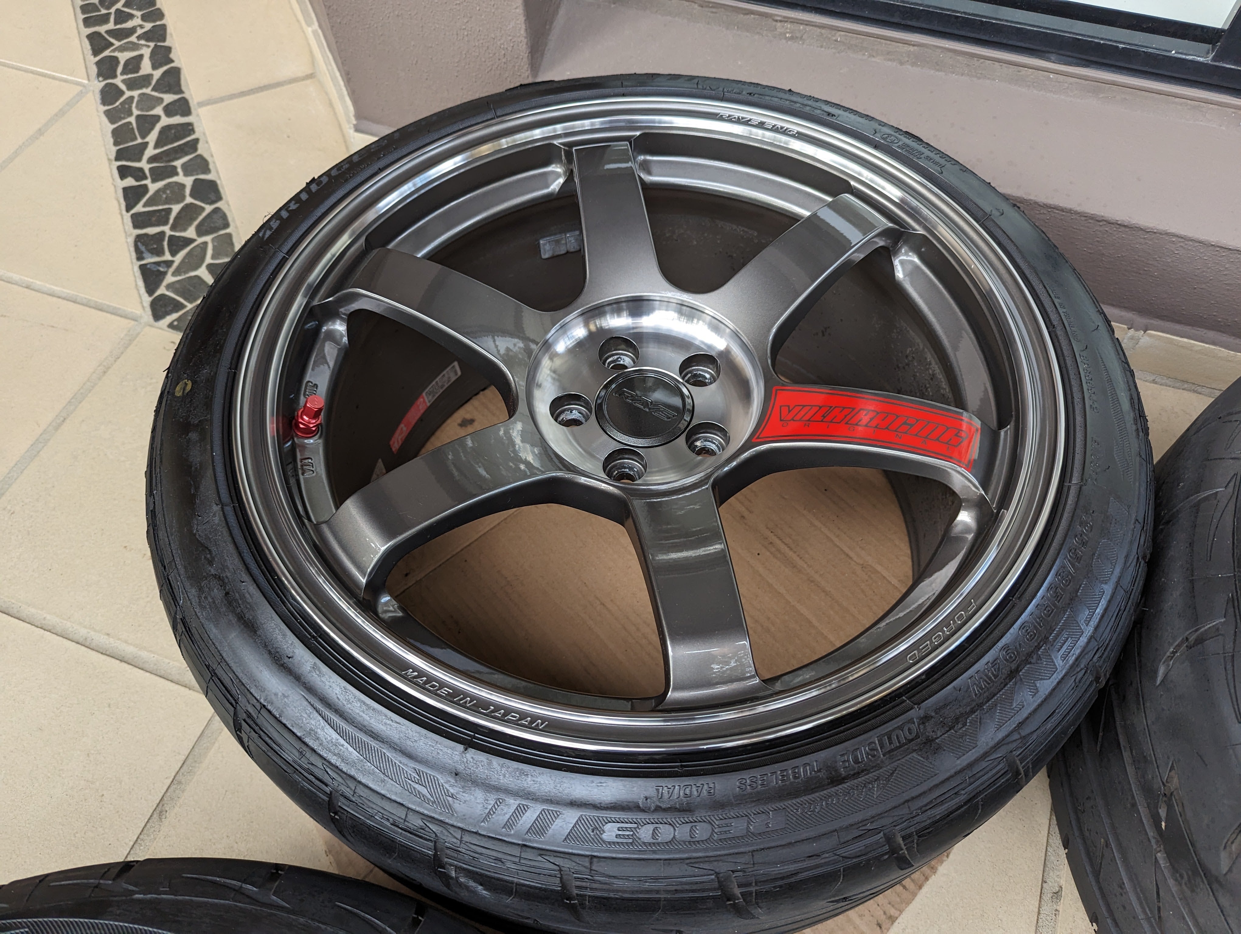 Rays Volk Racing TE37 Saga SL (Pressed Graphite) with Genuine Rays Center Caps and Brand New Bridgestone RE003 Tyres