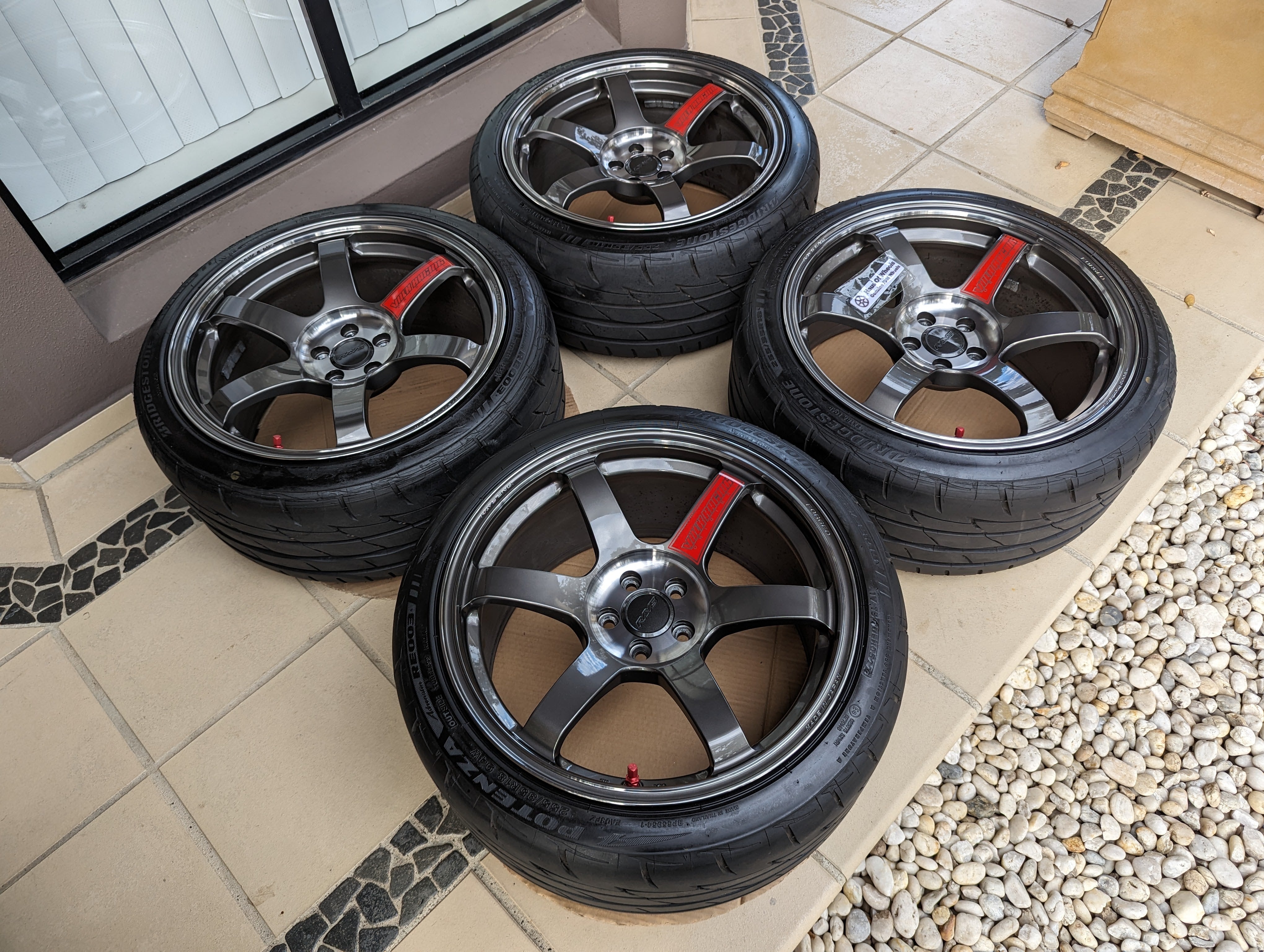 Rays Volk Racing TE37 Saga SL (Pressed Graphite) with Genuine Rays Center Caps and Brand New Bridgestone RE003 Tyres