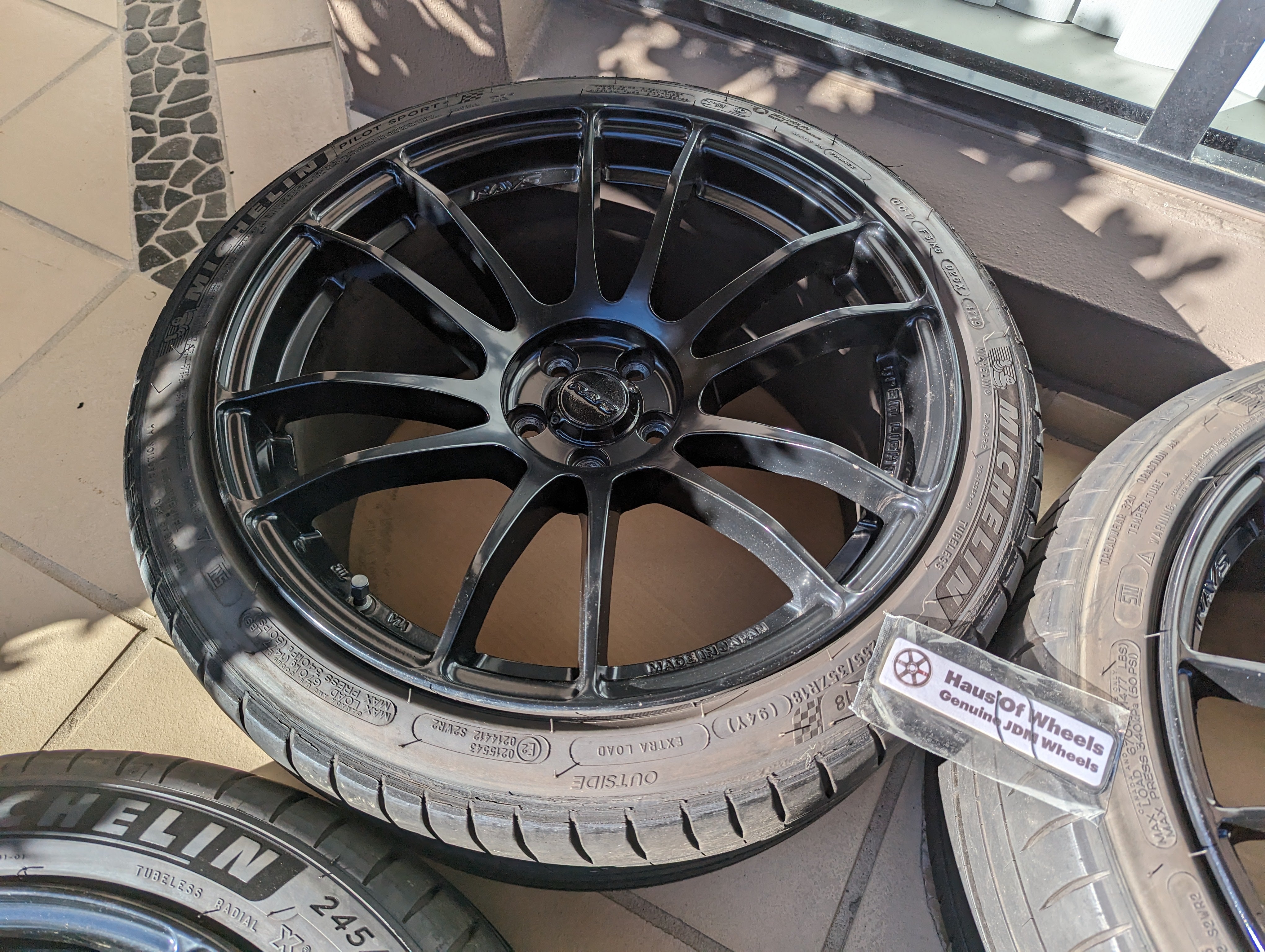 Rays Gram Lights 57XR (Gloss Black) with Genuine Rays Center Caps and Michelin Pilot Sports 4 Tyres