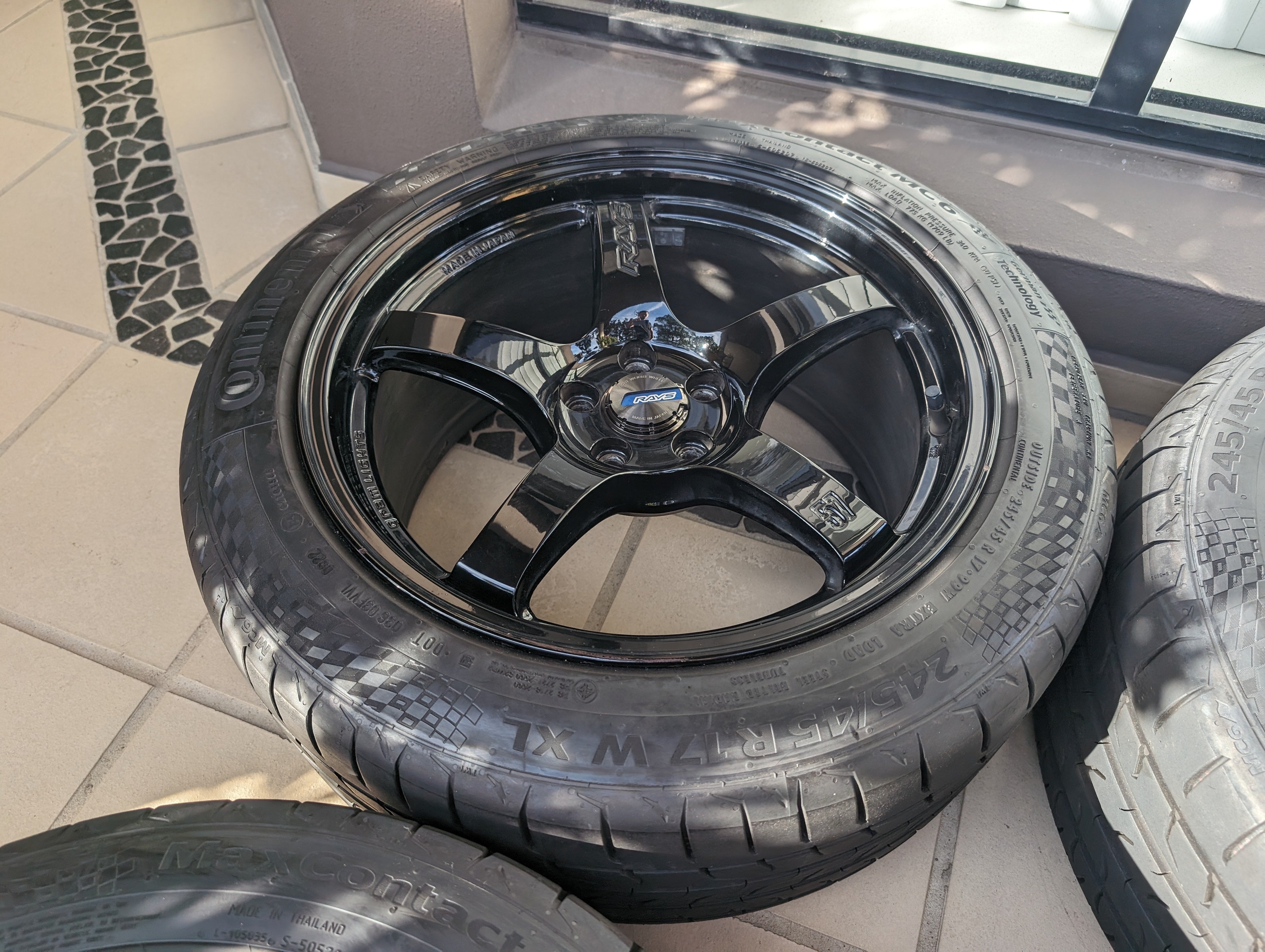 Rays Gram Light 57 CR (Gloss Black) with Near New Continental Tyres and Center Caps - 5x100 17x9 +38 (245/45/17)