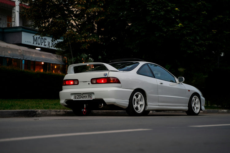 White Honda Integra Type R photographed outdoors; illustrative wheel fitment guide photo