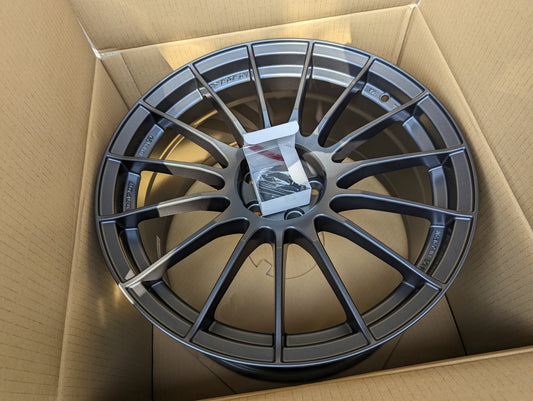 
Enkei RS05RR (Dark Gunmetal Gray) with Genuine Enkei Center Caps + Stickers