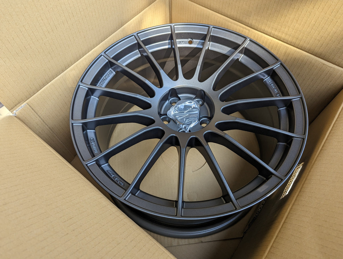 Enkei RS05RR (Dark Gunmetal Gray) with Genuine Enkei Center Caps + Stickers